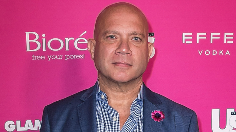 Eric Eremita posing on step-and-repeat