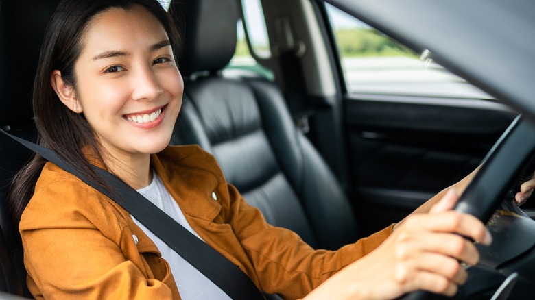 Woman smiling in car