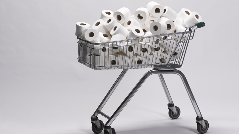 shopping cart filled with toilet paper