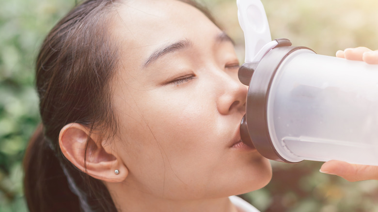 Man drinking pre-workout