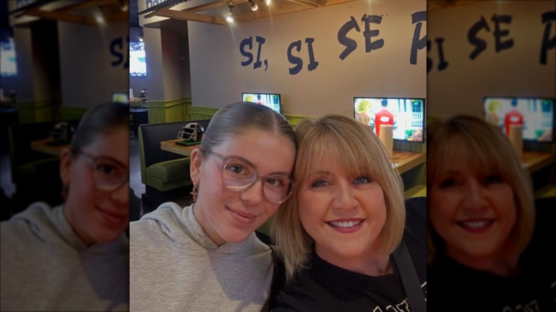 Tina Yothers posing with her daughter at a restaurant in 2026