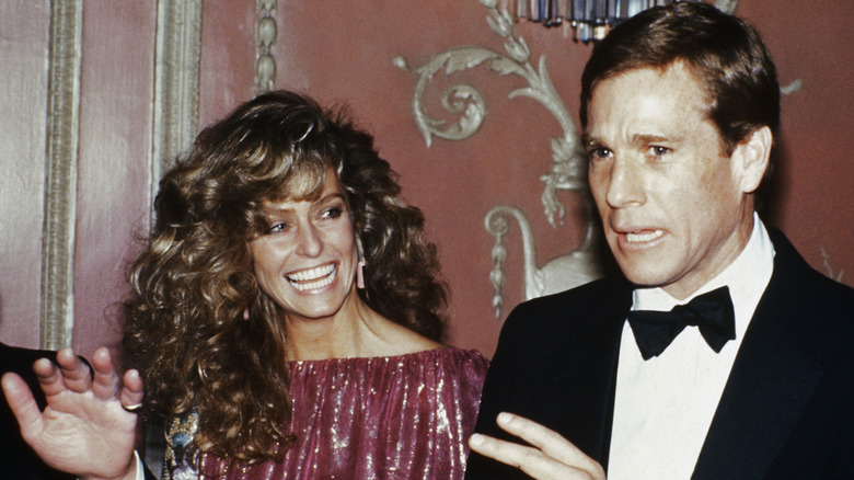 Farrah Fawcett and Ryan O'Neal in formal wear at a Friar's Club event