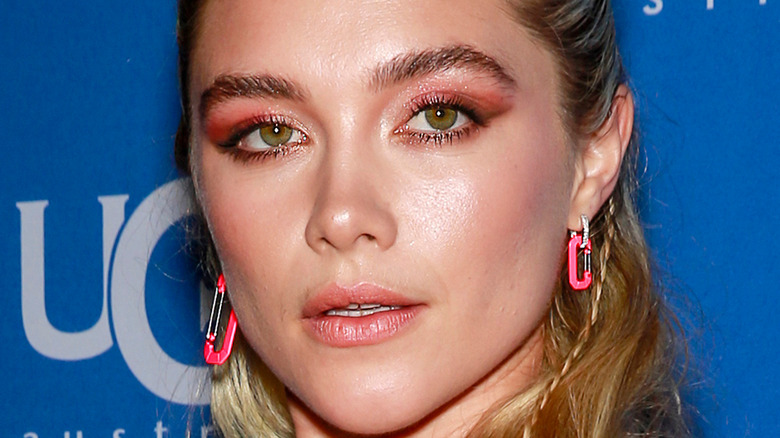 Florence Pugh poses in pink glitter eyeshadow