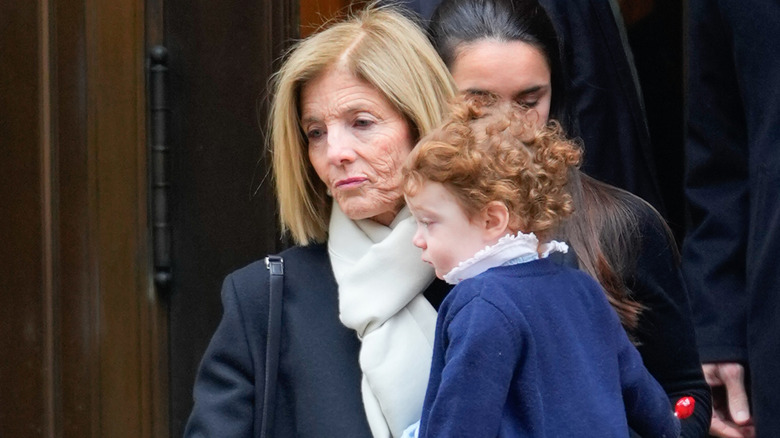 Caroline Kennedy holding Josephine Moran at Tatiana Schlossberg's funeral