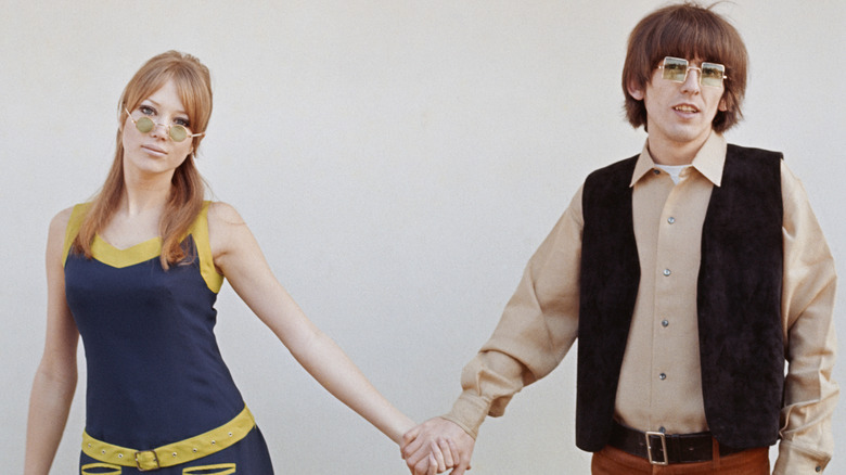 Pattie Boyd and George Harrison holding hands