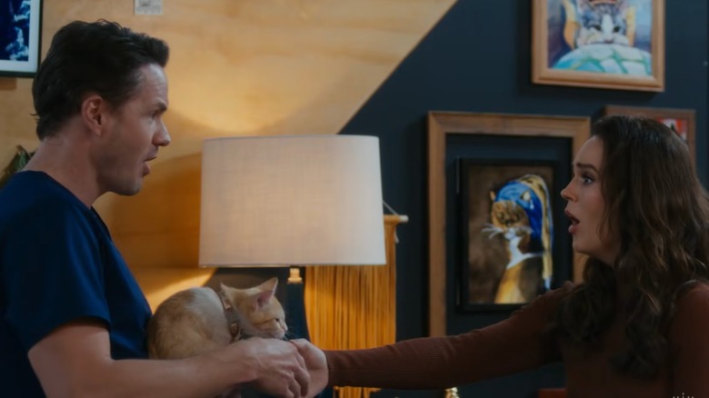 Olivia (Erin Cahill) shakes hands with Dr. Ben Kane (Paul Campbell) in Christmas at the Catnip Cafe