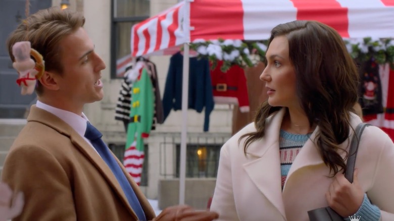 Evan Roderick and Kat Barrell looking at each other in A Tale of Two Christmases
