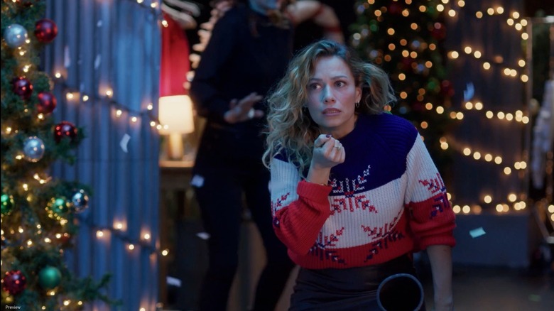 Bethany Joy Lenz looking concerned as Emily in An Unexpected Christmas