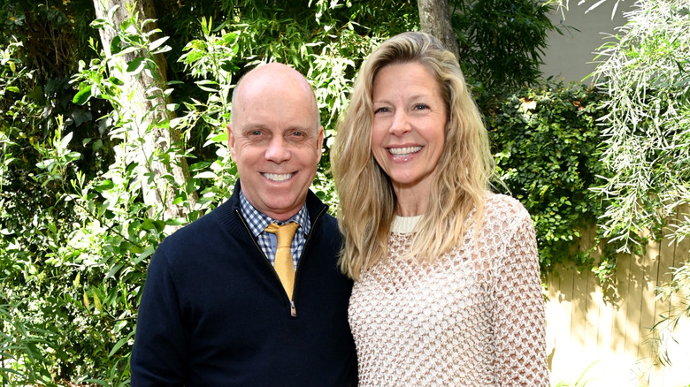 Scott Hamilton and Tracie Hamilton smiling together at an event in 2025