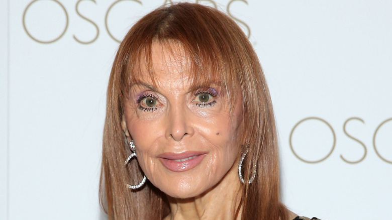The last surviving "Gilligan's Island" actor Tina Louise looks at the camera on the red carpet wearing hoop earrings and her hair straight