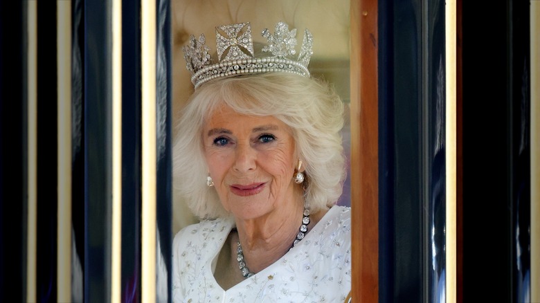 Queen Camilla wearing tiara in carriage