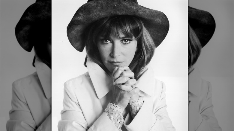 Lee Grant clasping her hands together under her chin in a portrait from 1970