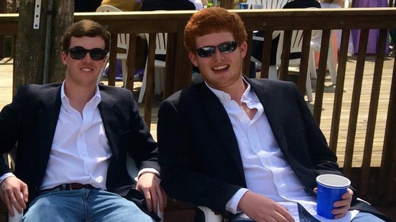 Buster Murdaugh smiling with friends wearing a blazer