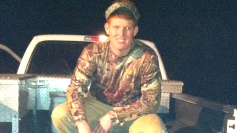 Buster in camo hunting gear