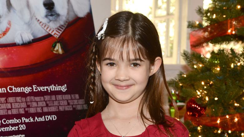 Kaitlyn Maher smiling at the "Santa Paws 2" holiday party in 2012