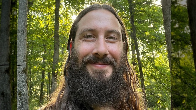 Avi Kaplan smiles as he takes a selfie in a forest in Nashville, Tennessee