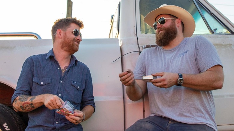 Randy Sherrell and Ben Napier having a brotherly moment while wearing sunglasses