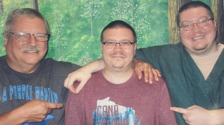 Brendan Dassey posing with his father and brother in prison