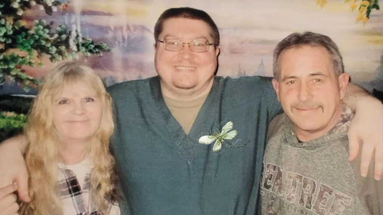 Brendan Dassey posing with his mother and stepfather