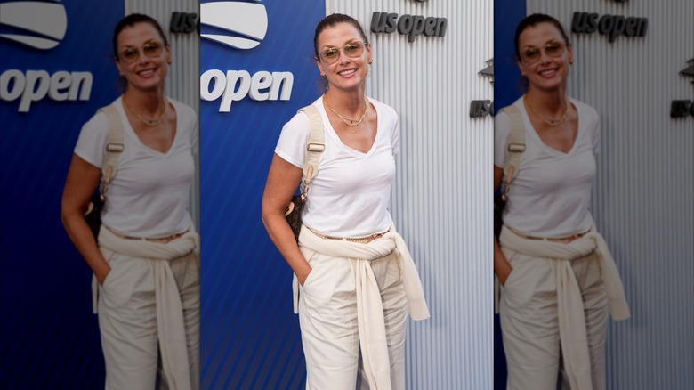 Bridget Moynahan smiles in a white outfit