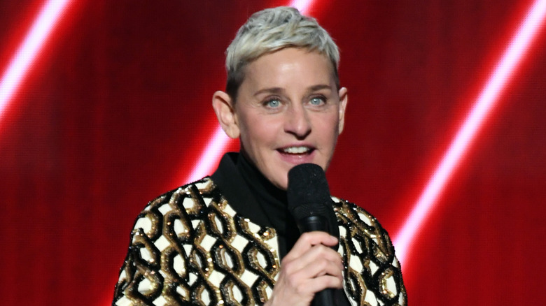 Ellen DeGeneres dark blue blazer waving