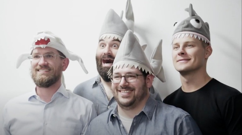 Bryan DeLuca, Matt McClard, Tom Browning, and Kelly Largent in shark hats