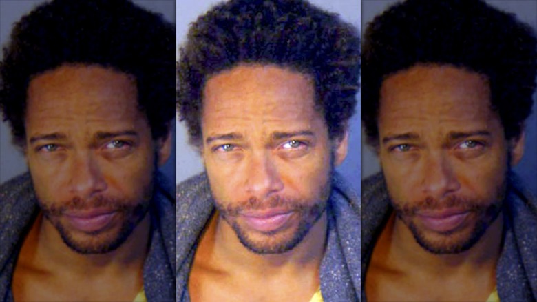 Gary Dourdan's 2008 mugshot, taken close up as he looks up at the camera