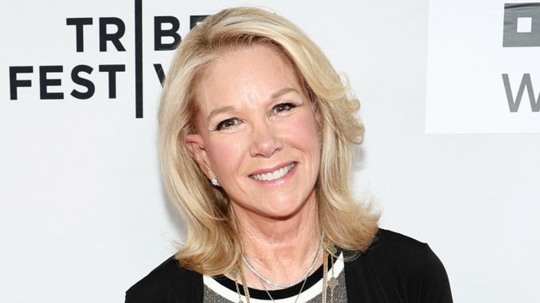 Joan Lunden posing in front of a white background at the Tribeca Film Festival