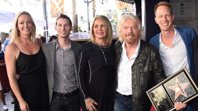 Justin Berfield smiles on the Hollywood Walk of Fame with Richard Branson and others