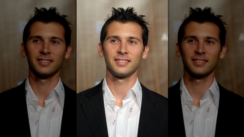 Closeup of Justin Berfield smiling in white shirt and black jacket
