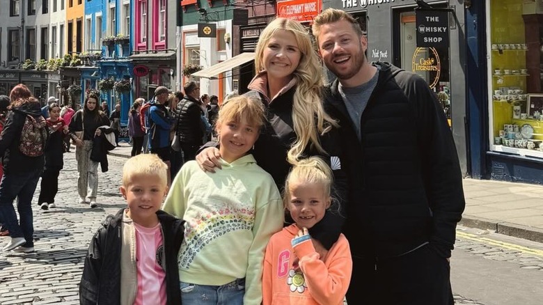 Elizabeth Smart, her husband Matthew Gilmour, and their three children smiling together