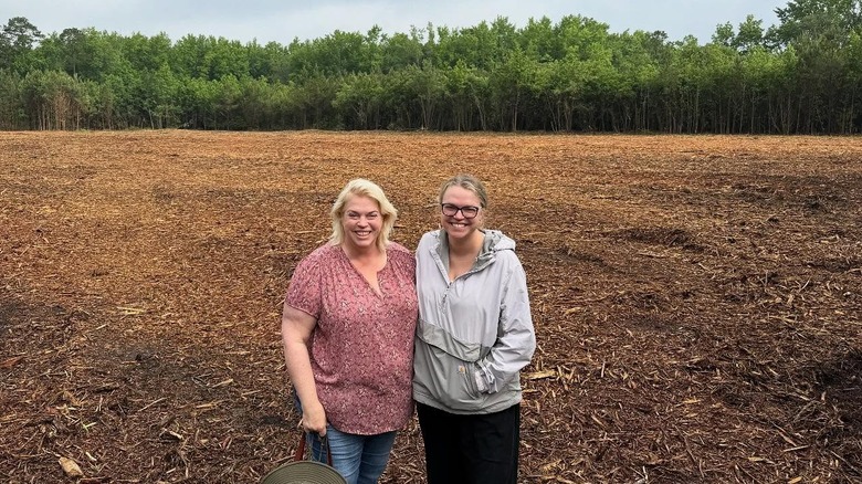 Janelle Brown and Madison Brush smiling on their farm