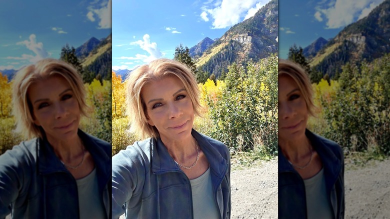 Meri Brown taking a selfie in front of mountains