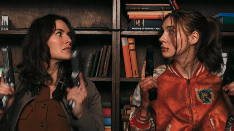 Lena Headey and Karen Gillan holding guns in a scene from "Gunpowder Milkshake"