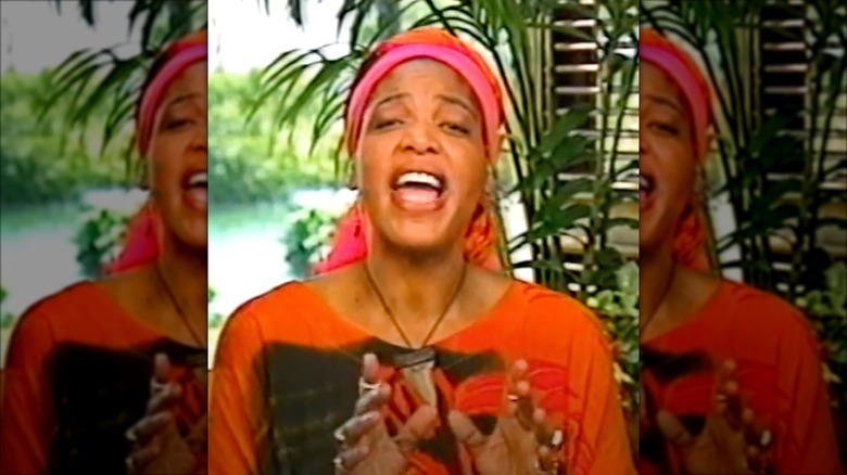 Miss Cleo in a tarot reading instructional video