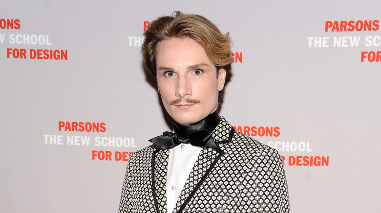 Austin Scarlett posing at an event in 2013.