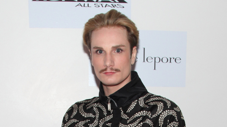 Austin Scarlett posing at an event in 2012
