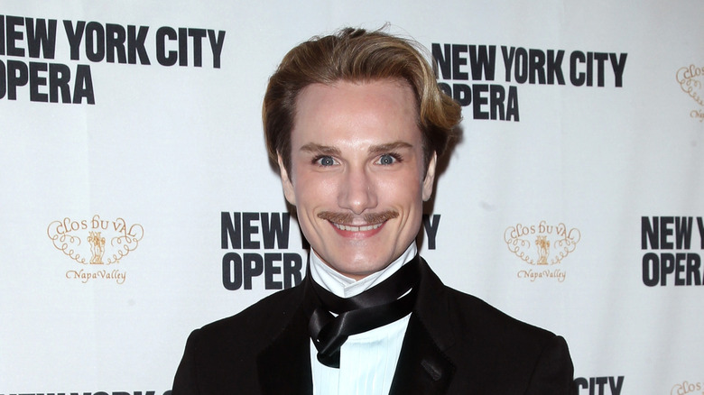 Austin Scarlett posing at an event in 2013.