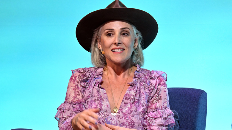 Ricki Lake speaking into a microphone at End Well 2024