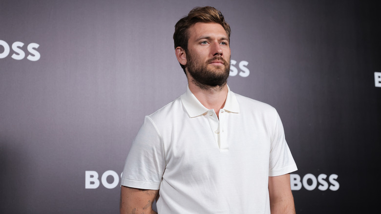 Alex Pettyfer posing on the red carpet 