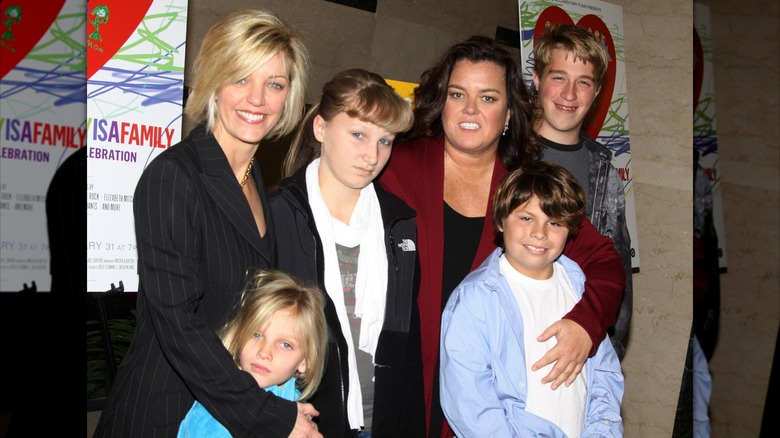 Rosie O'Donnell, Kelli Carpenter, and their children Parker, Chelsea, Blake, and Vivienne smiling and posing.