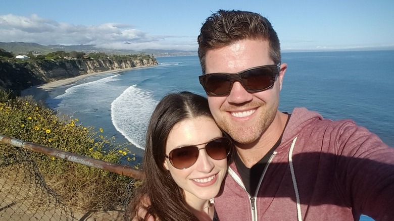 "The Middle" actor Beau Wirick and his co-star Daniela Bobadilla wearing sunglasses and smiling in an oceanfront selfie