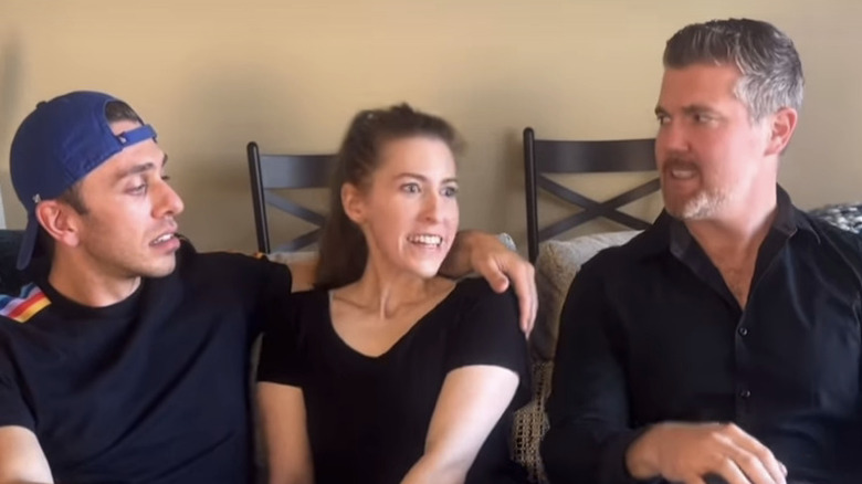 Sean Donahue, Brad, and Sue Heck from "The Middle" sit on a couch together staring at one another