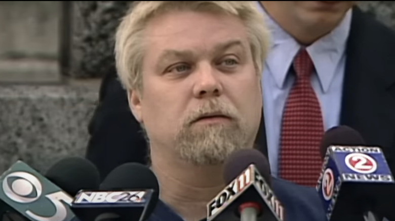 Steven Avery standing in front of news reporter microphones