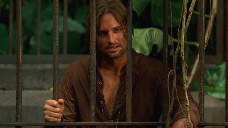 Josh Holloway playing Sawyer on Lost, holding on to cage bars