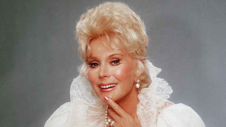 Eva Gabor putting her finger on her chin