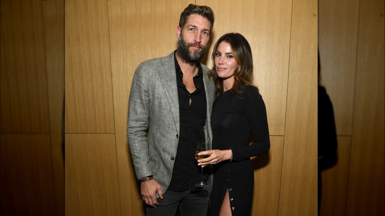 Jay Cutler posing next to Samantha Robertson