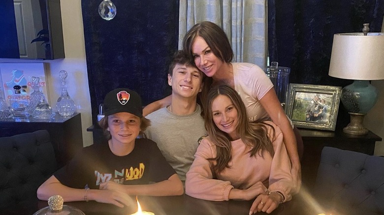 Debbe Dunning posing with her three children