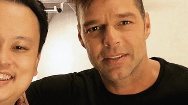 Half of William Hung's face in a selfie with Ricky Martin