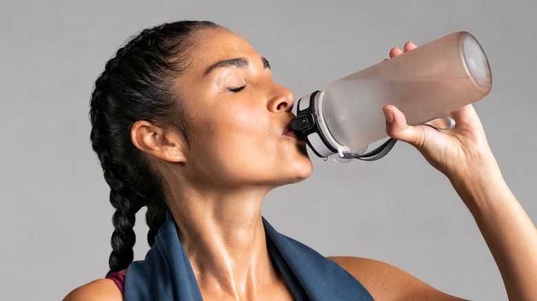 Woman drinking pre workout